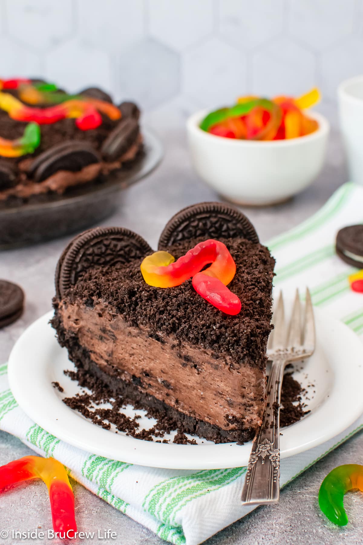 A slice of chocolate pie on a white plate.