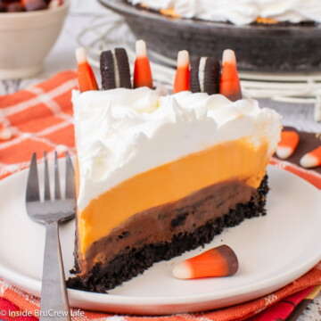 A slice of chocolate and orange pudding pie on a plate.