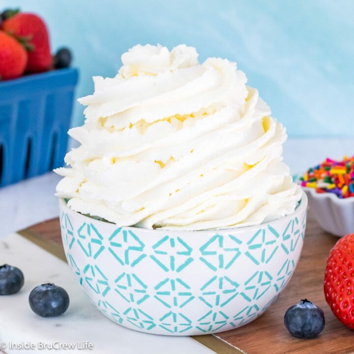 A bowl filled with a swirl of whipped topping.