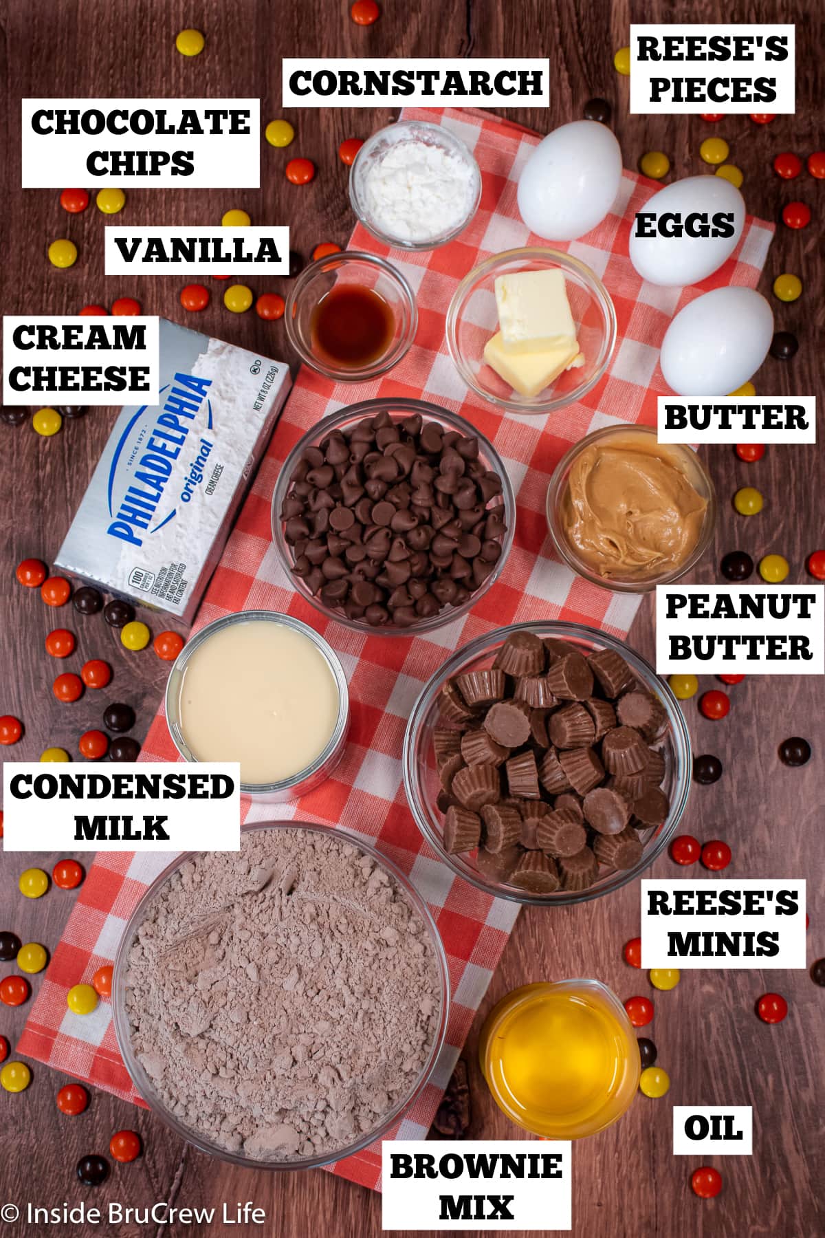 Ingredients needed to make a Reese's cheesecake with a brownie crust.