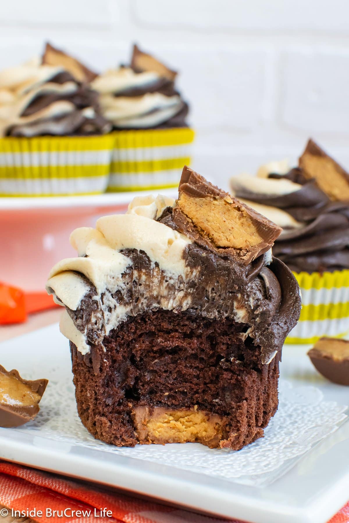 Frosted chocolate cupcakes with hidden peanut butter cups.