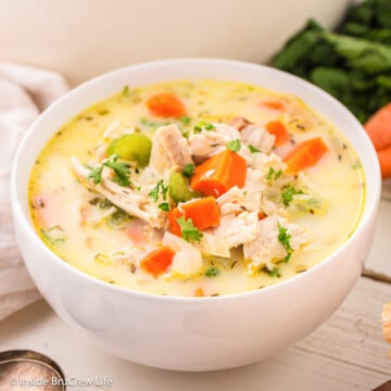 A white bowl filled with creamy soup.