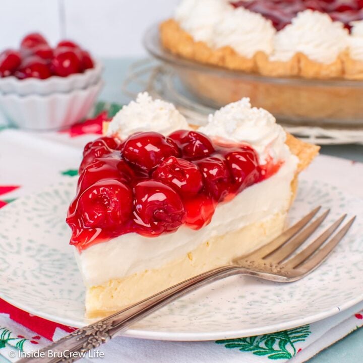 A slice of Cherry cheesecake pie on a plate.
