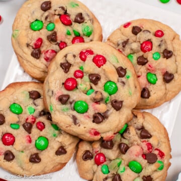 A close up of a holiday cookie with red and green candies.