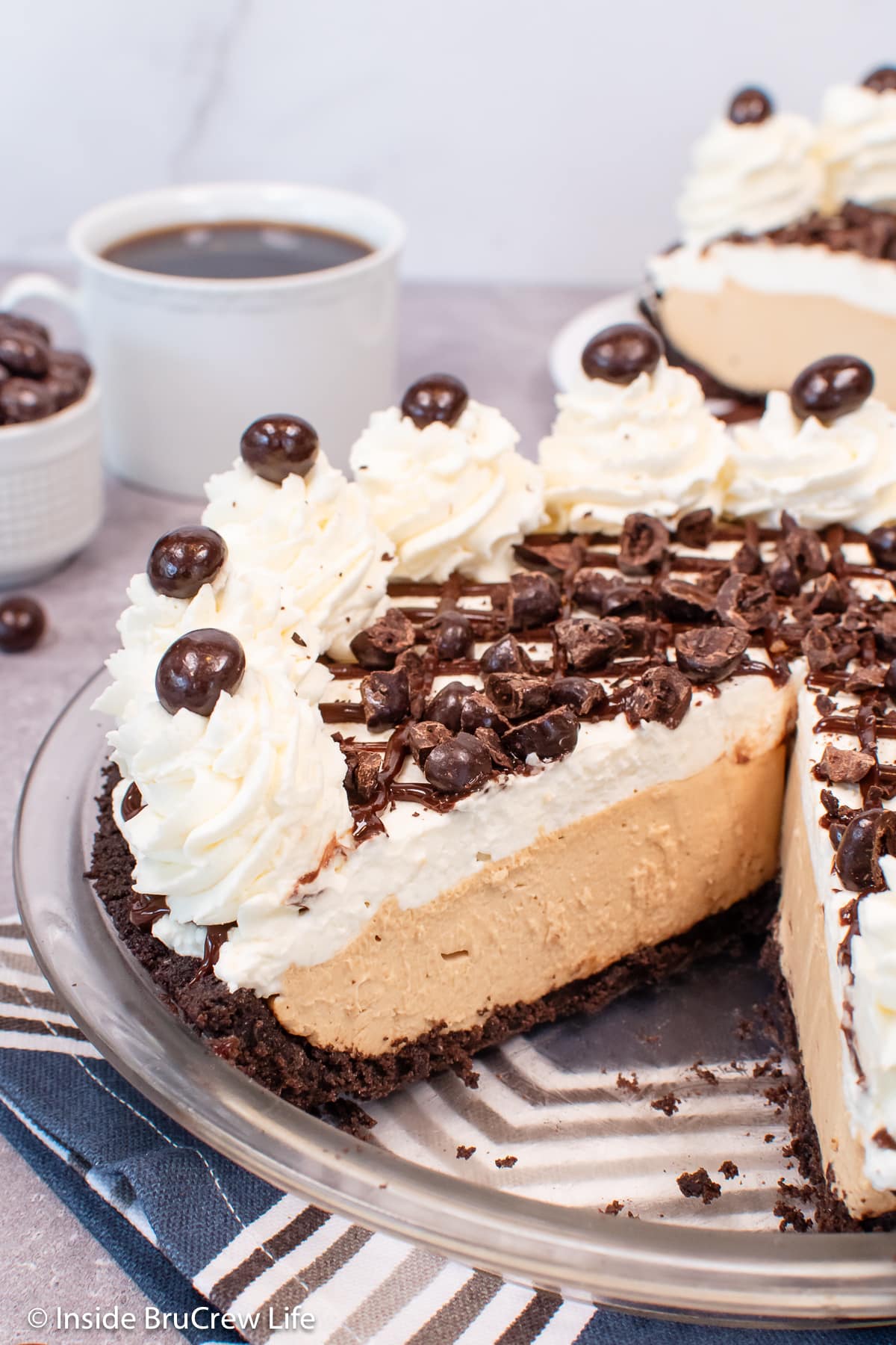 A coffee mousse pie in a glass pie plate.