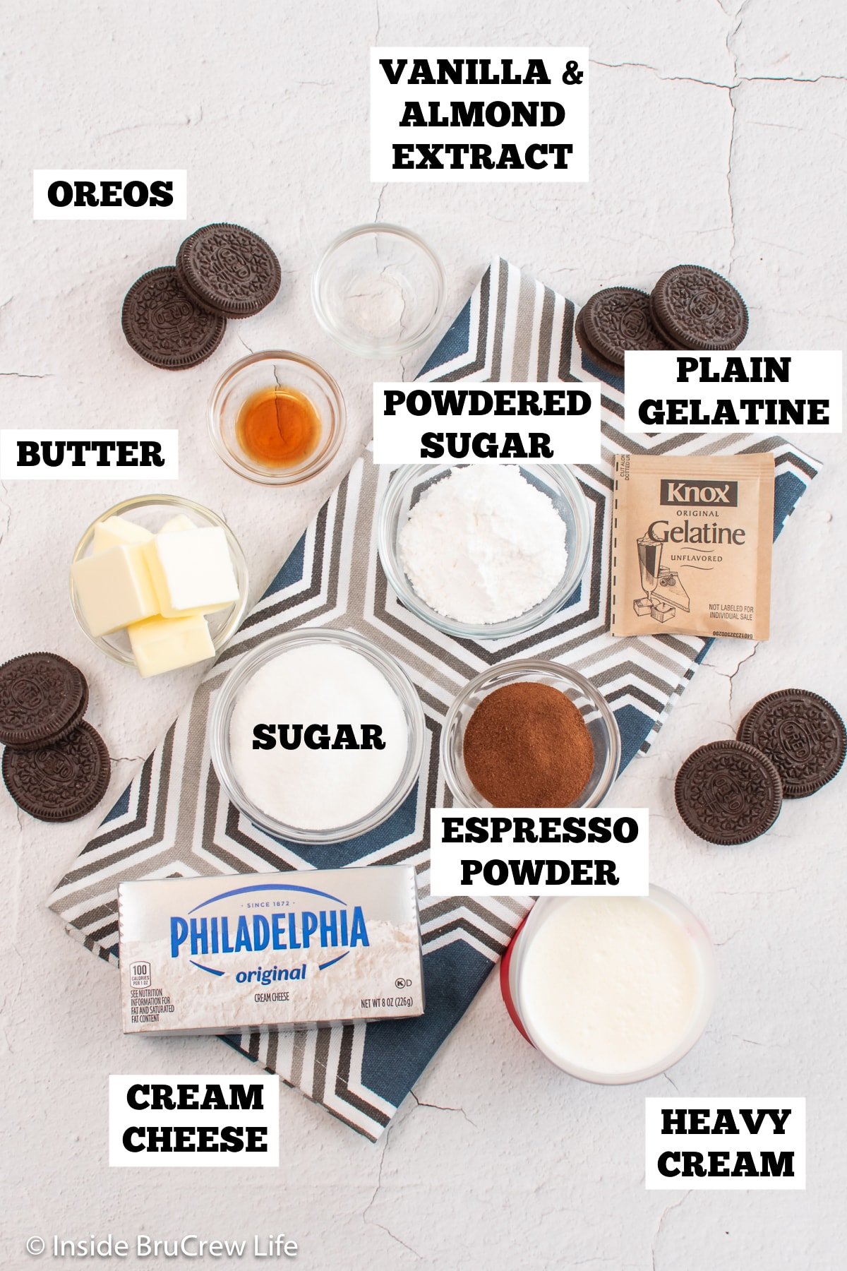 A white board with bowls of ingredients needed for a mousse pie.