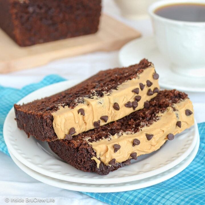 Two slices of mocha banana bread with chocolate chips on a white plate.