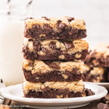 A stack of brookie bars on a white plate.