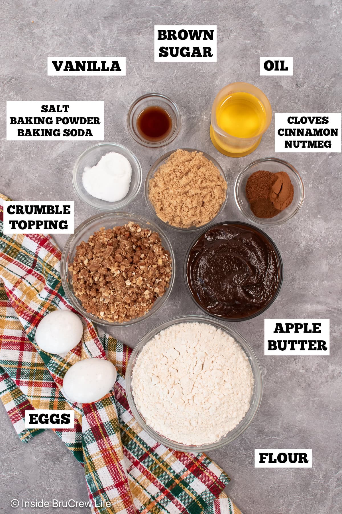 Bowls of ingredients needed to make streusel muffins with apple butter.