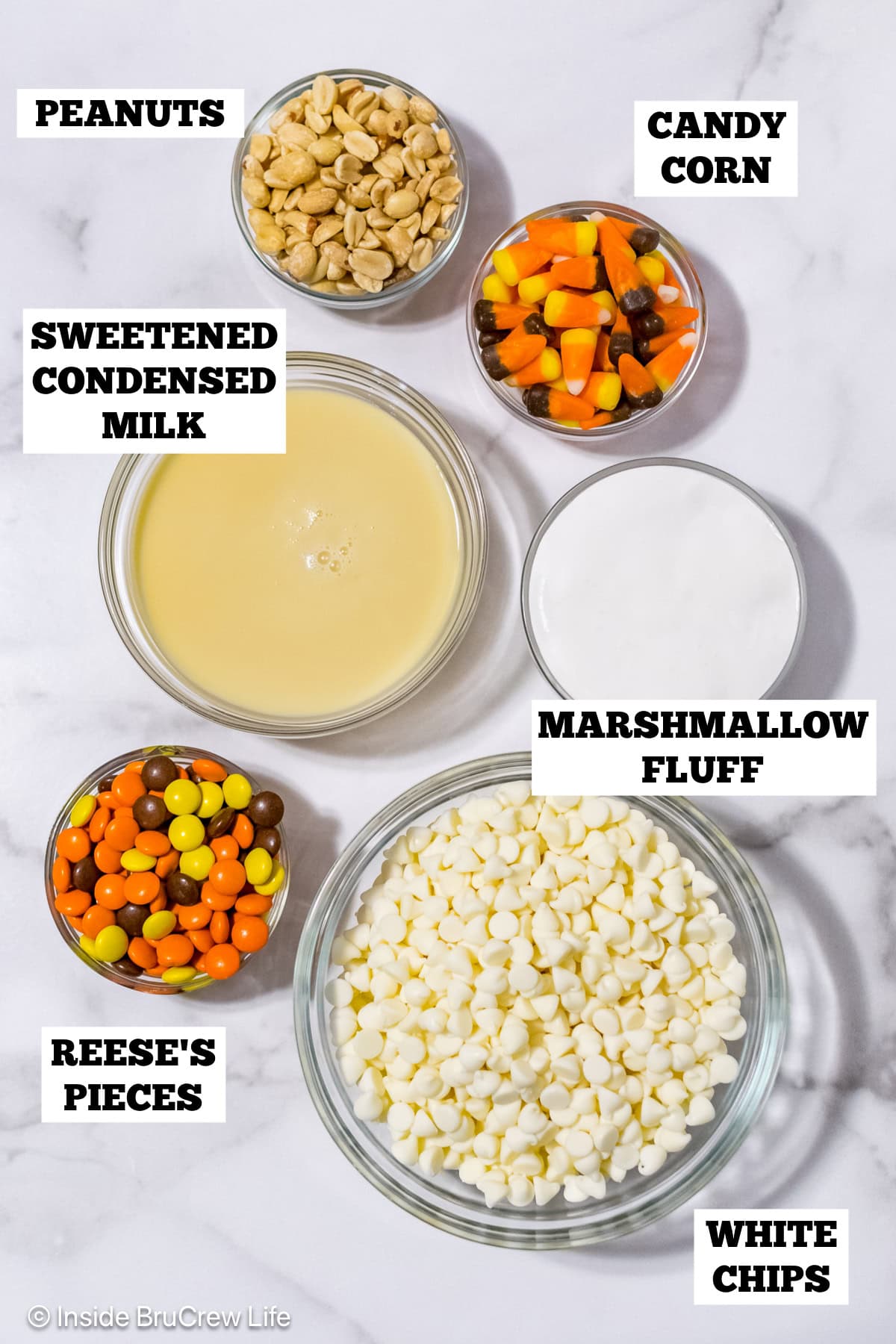 Bowls of ingredients needed to make a fall fudge treat.