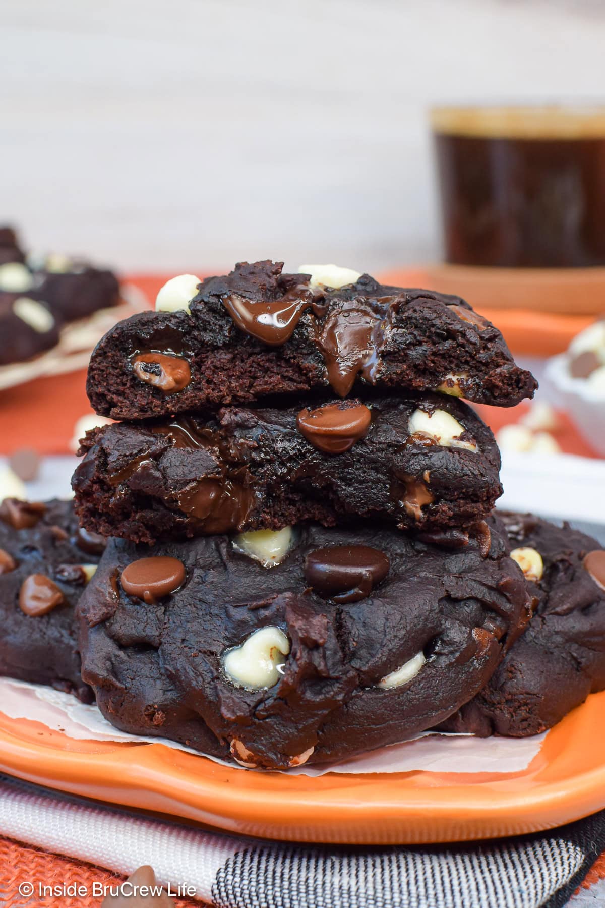 A stack of fudgy chocolate pumpkin cookies.