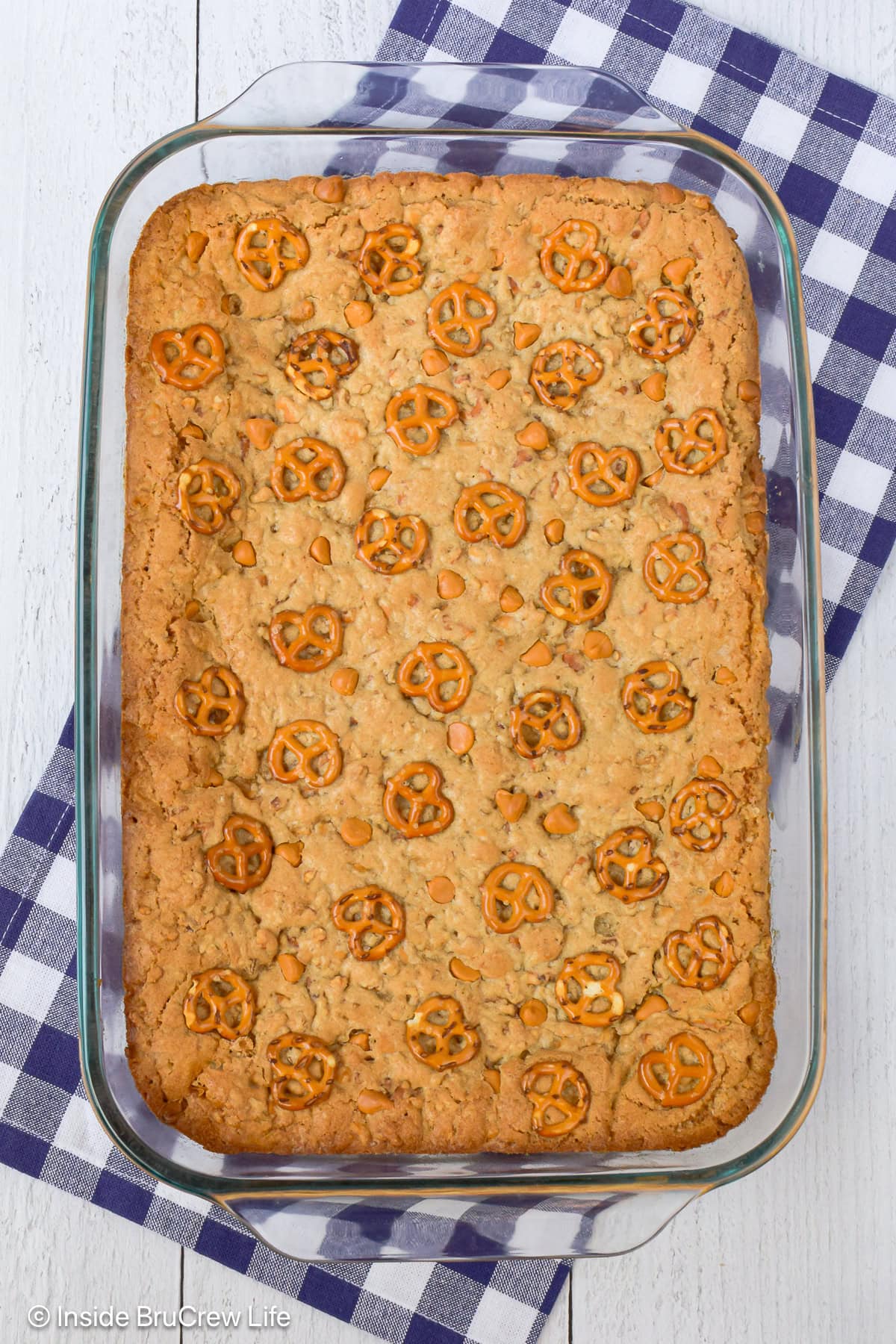 A glass pan filled with sweet and salty blonde brownies.