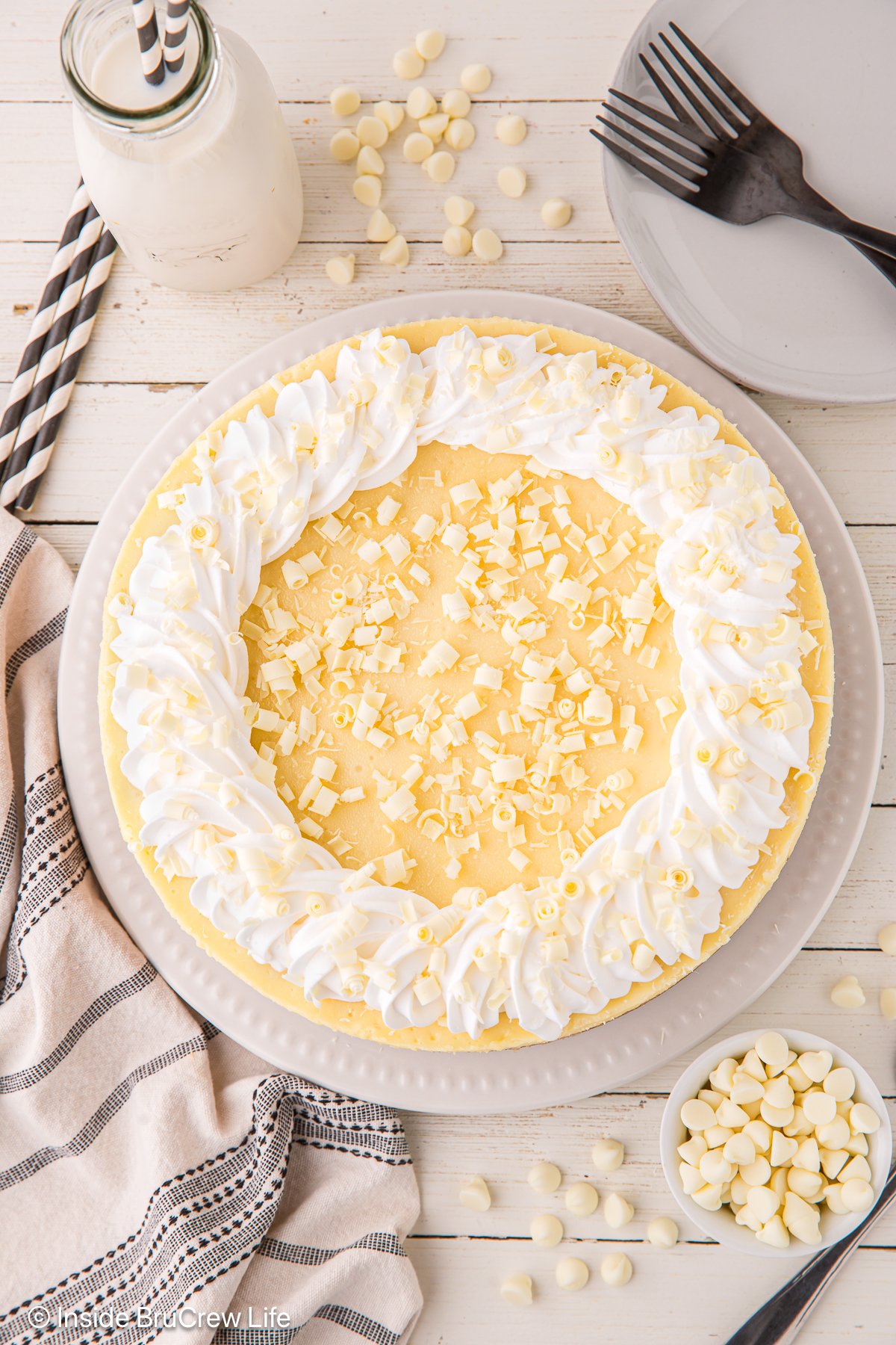 A decorated cheesecake on a plate.