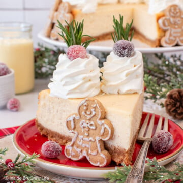 A red plate with a slice of holiday cheesecake on it.