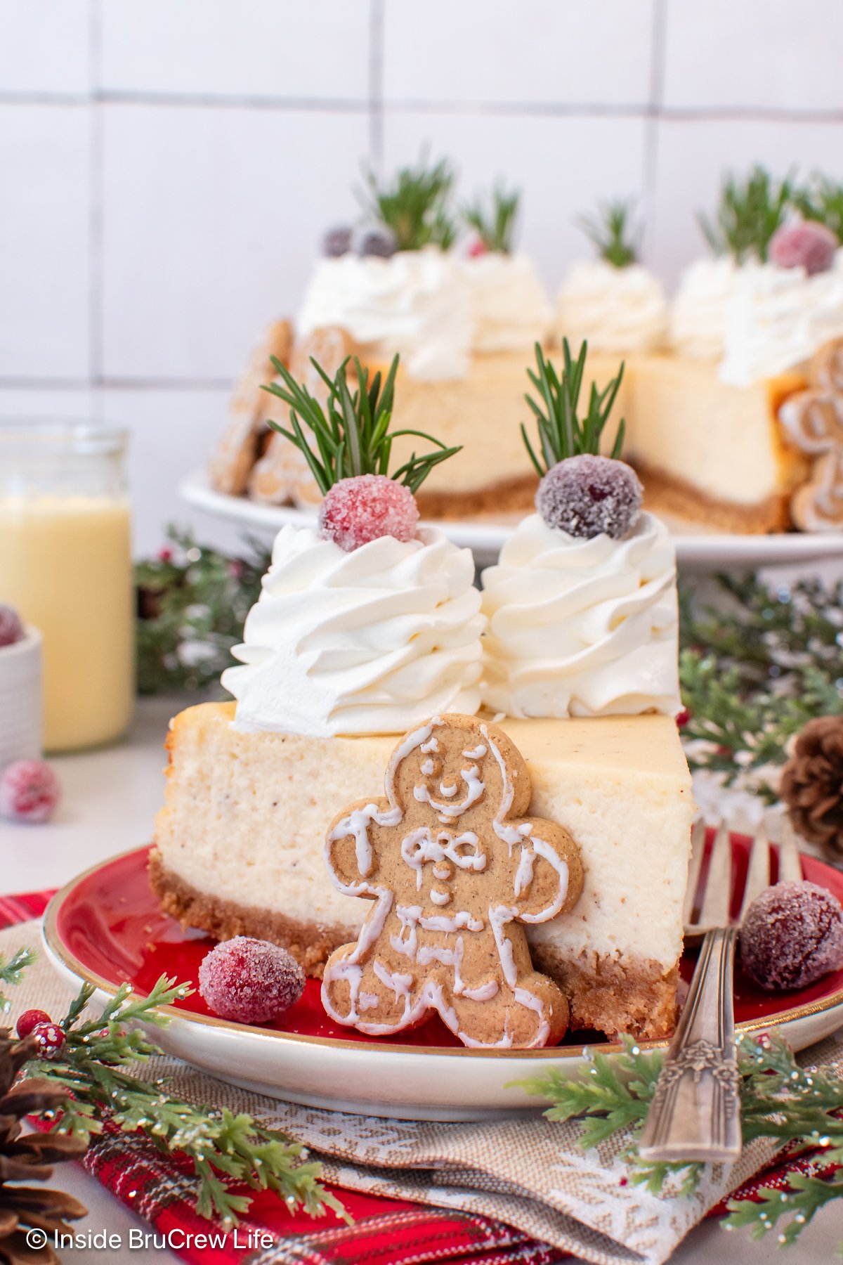 A large slice of eggnog cheesecake on a red plate.