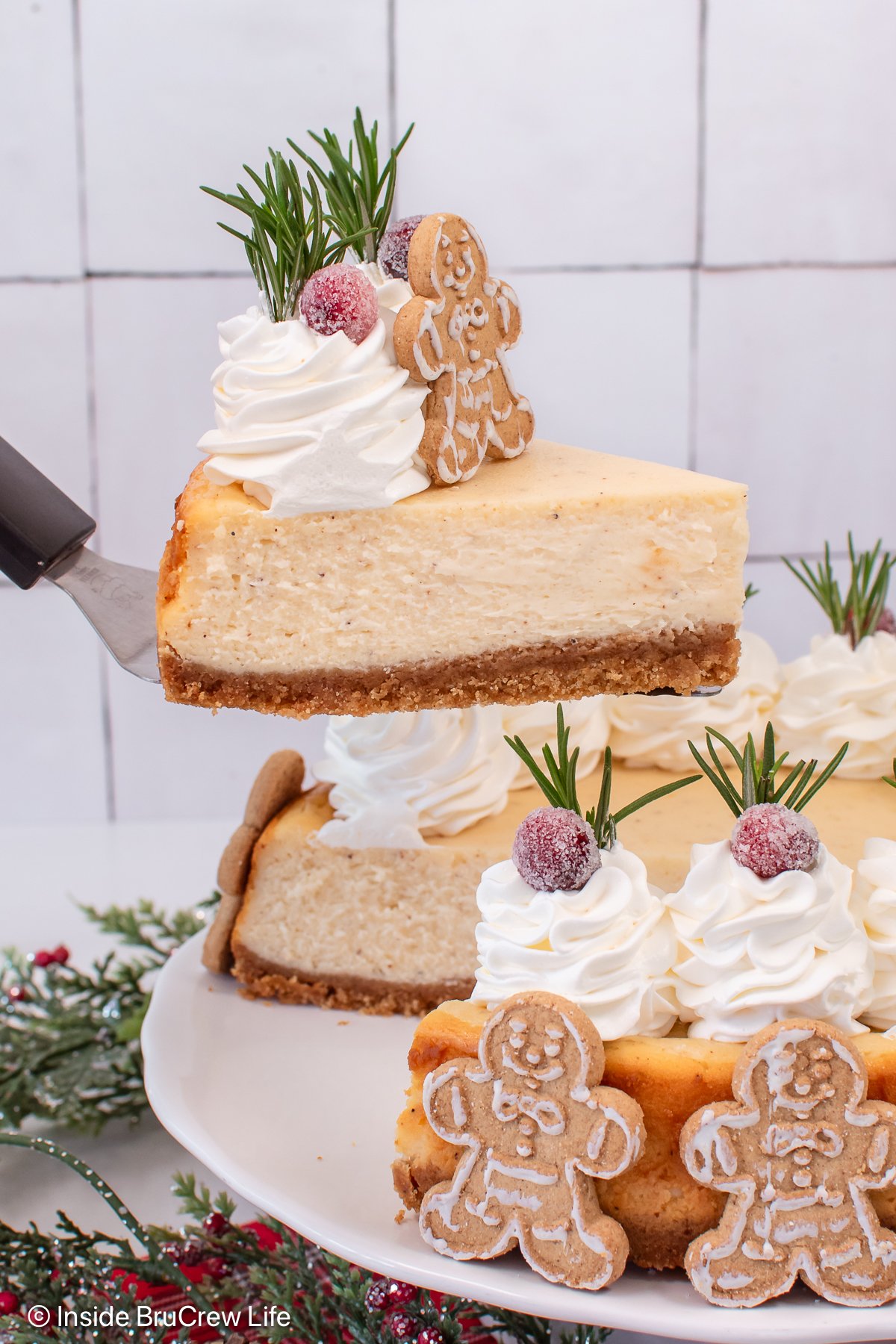 A slice of cheesecake being lifted off a plate.