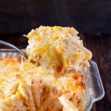 A scoop of buffalo pasta being lifted out of a pan.