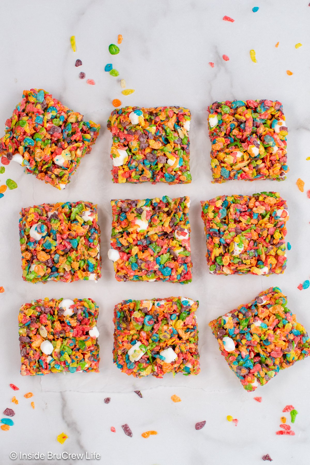 Fruity pebbles treats on a white board.