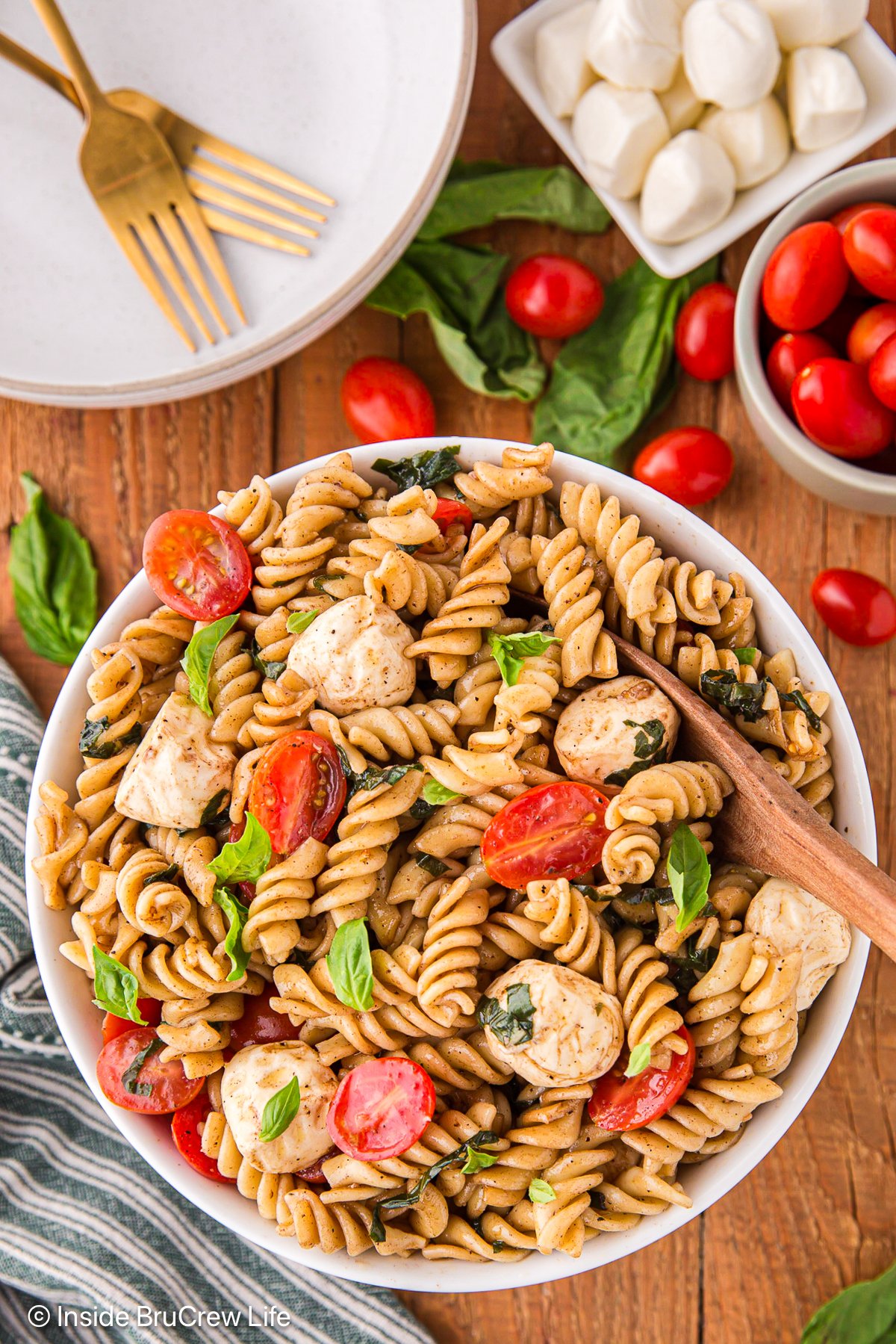 An overhead picture of a cold pasta salad in a white bowl.