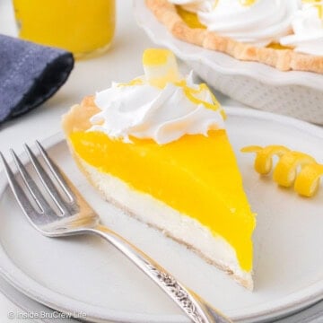 A slice of lemon supreme pie on a white plate.