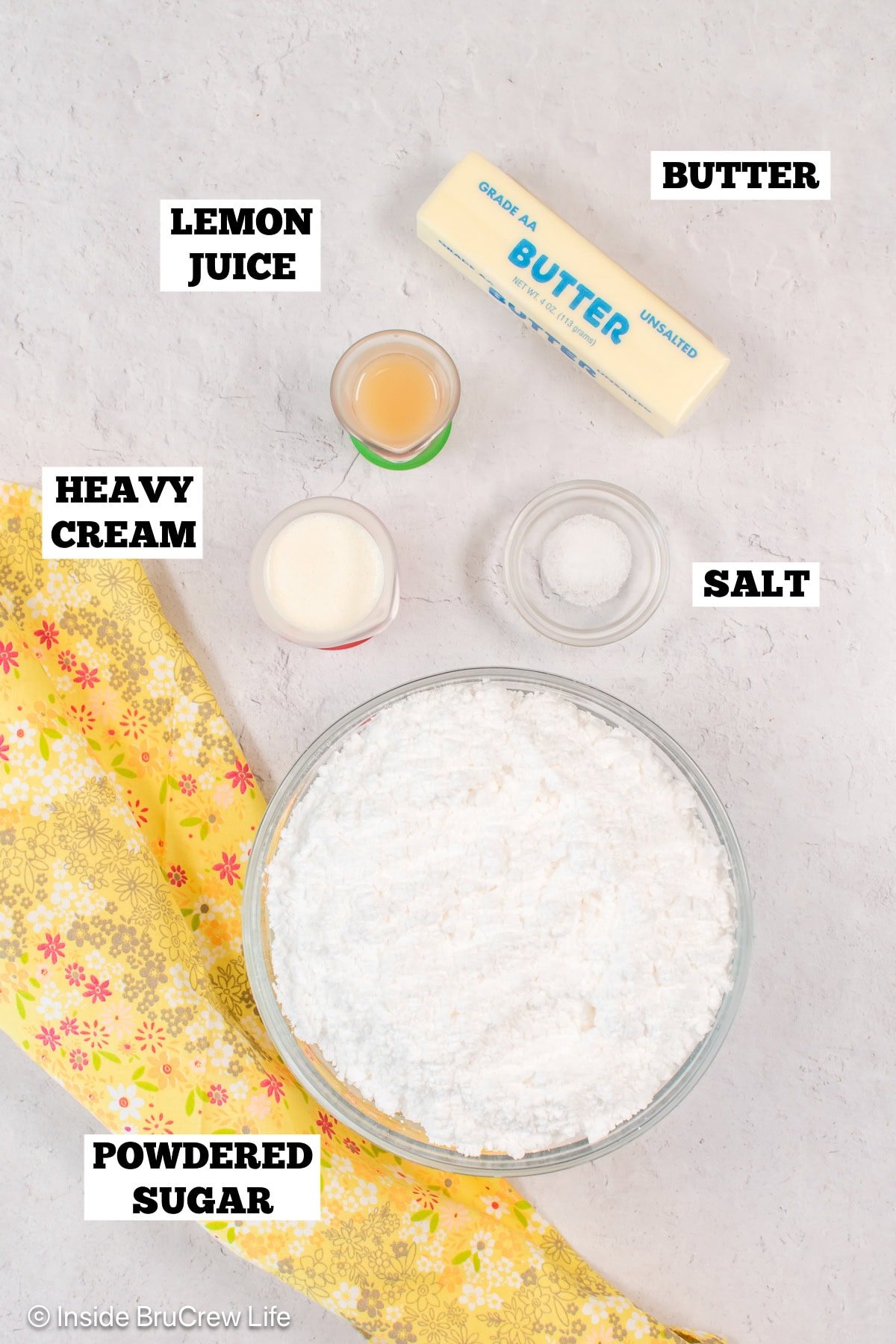 Bowls of ingredients needed to make an easy lemon frosting.