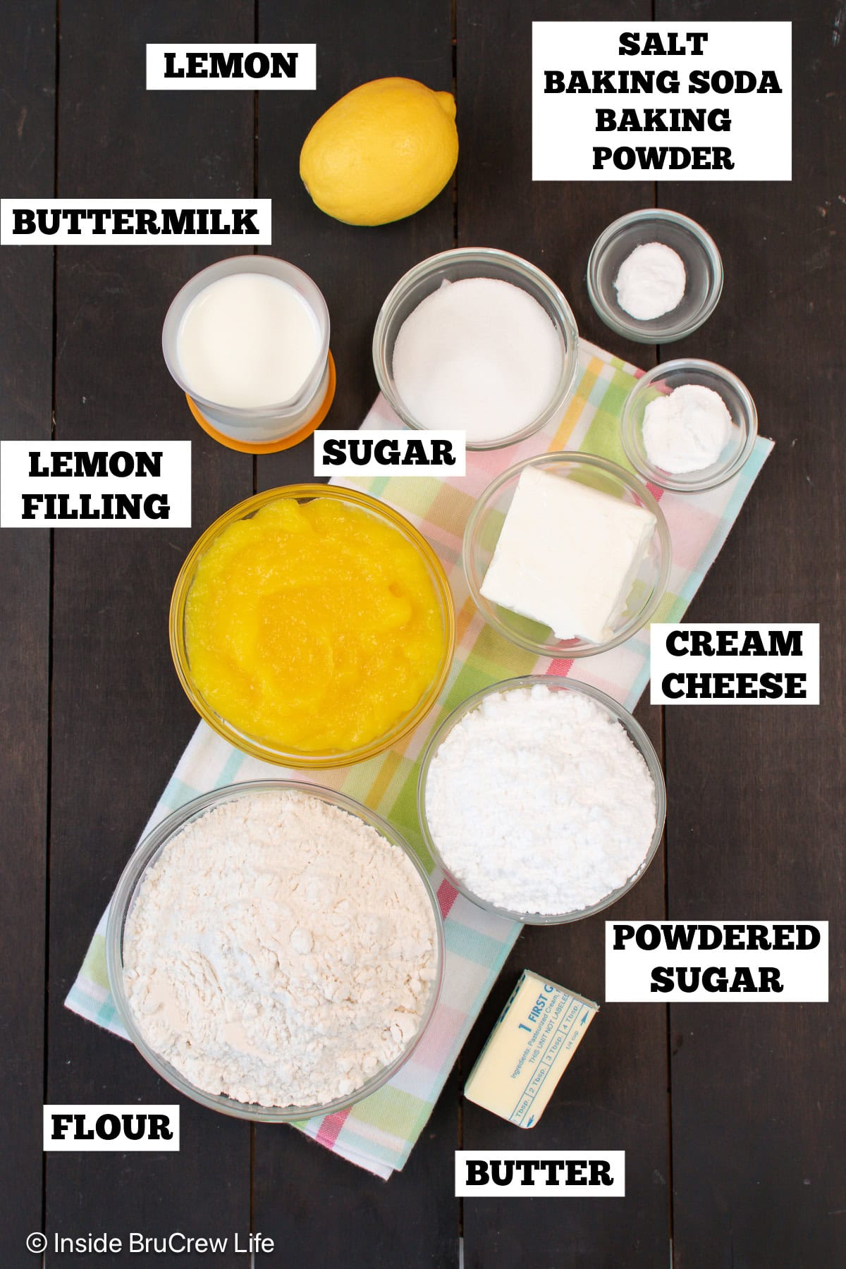 Bowls of ingredients needed to make lemon sweet rolls.