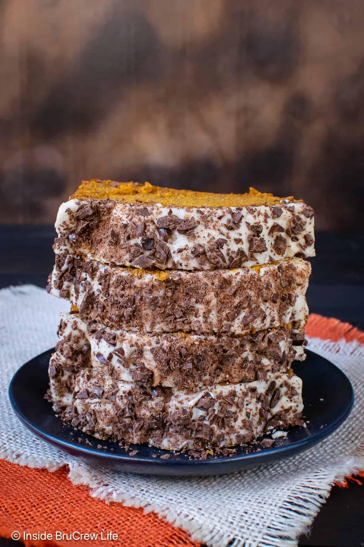 Slices of pumpkin bread topped with glaze and espresso beans.
