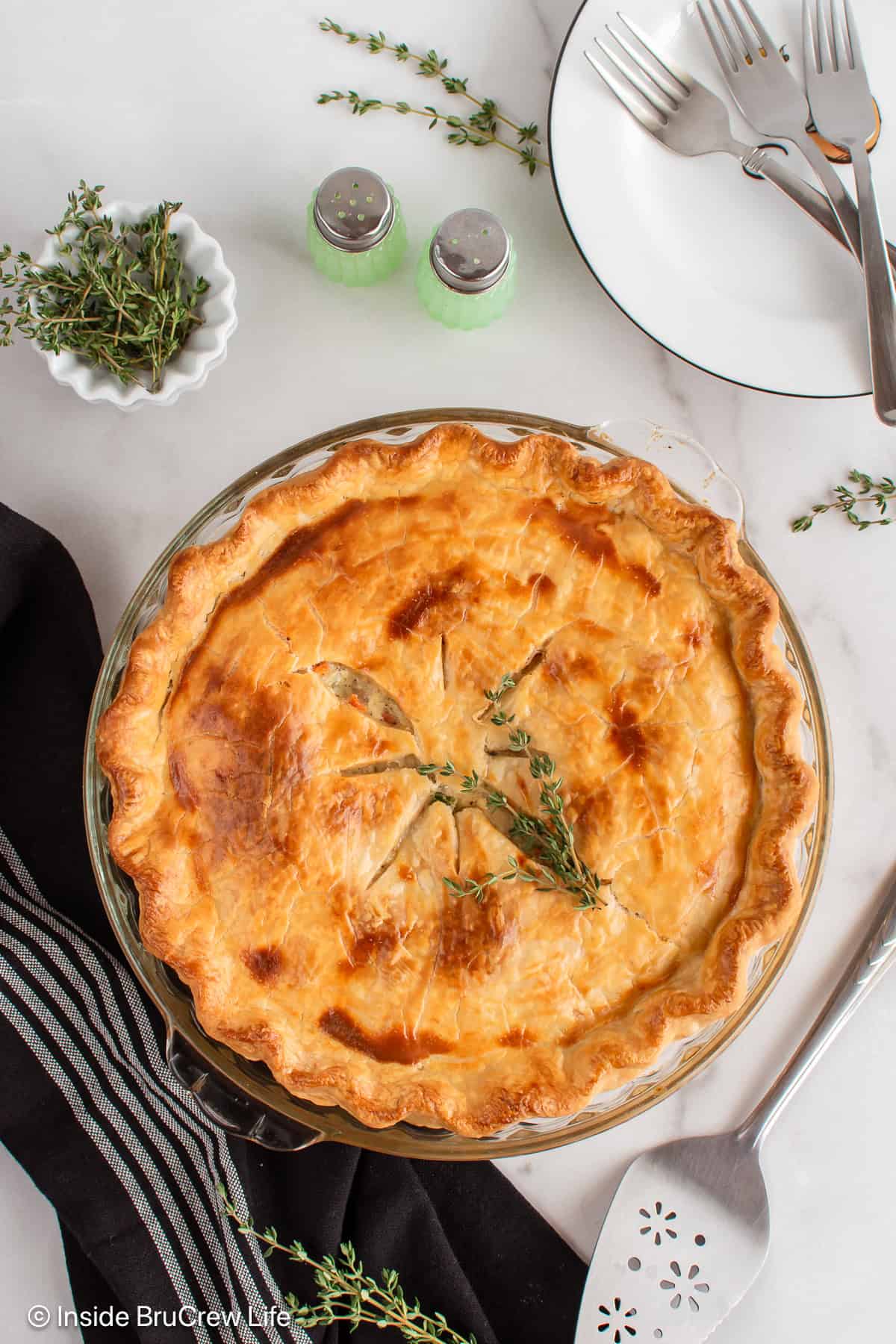 Overhead picture of a baked chicken pot pie with a golden crust.