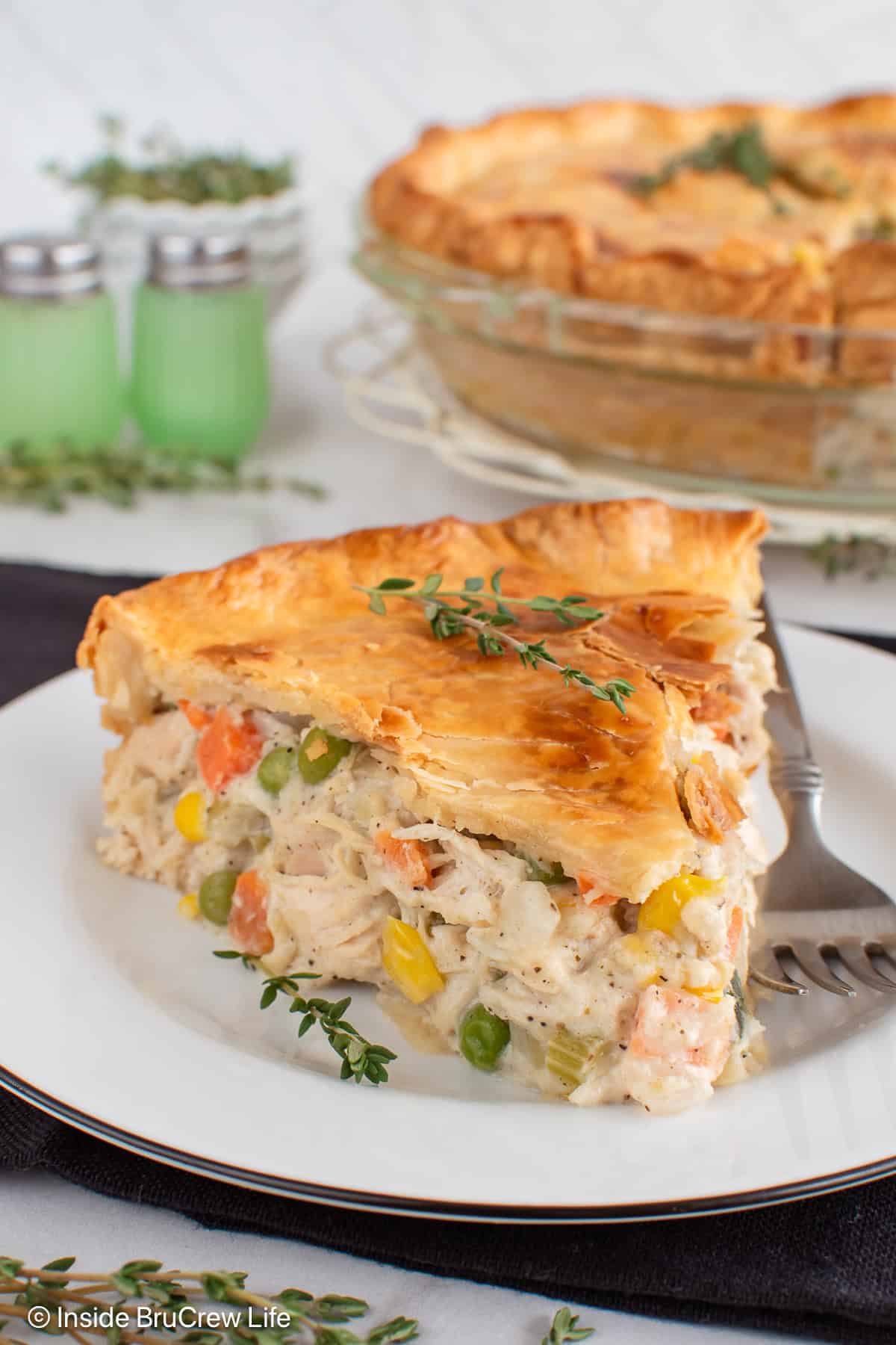 A big slice of easy homemade chicken pot pie on a white plate.