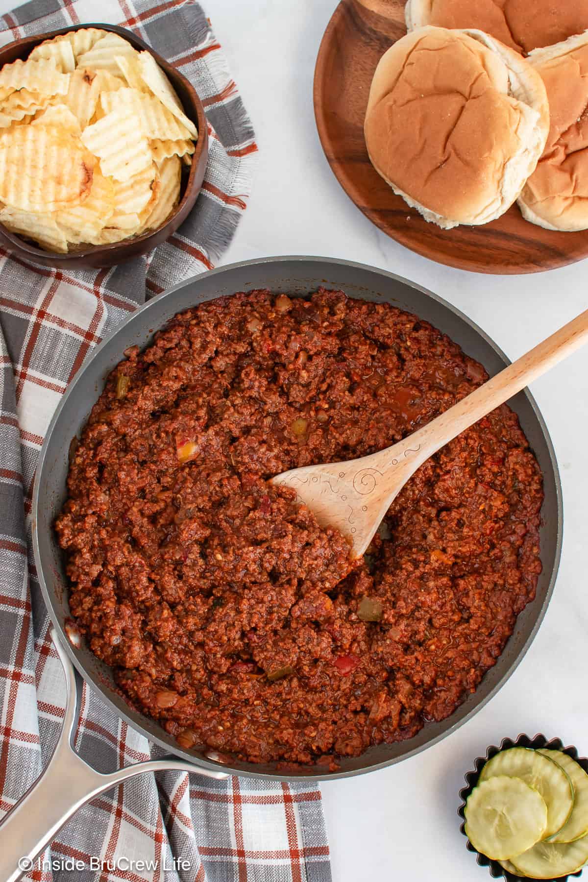 An overhead picture of a skillet filled with a homemade sloppy joe recipe.