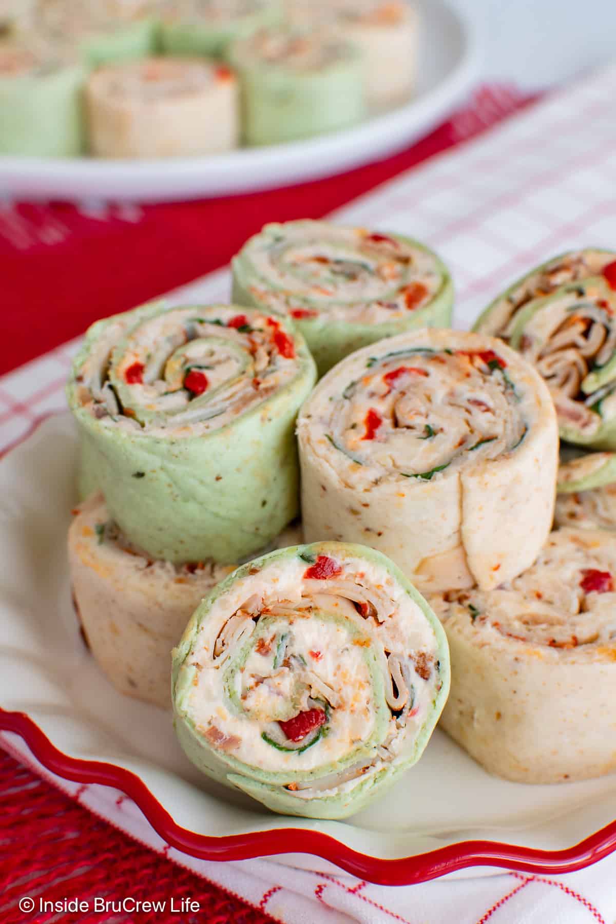 A plate filled with tortilla turkey pinwheels.