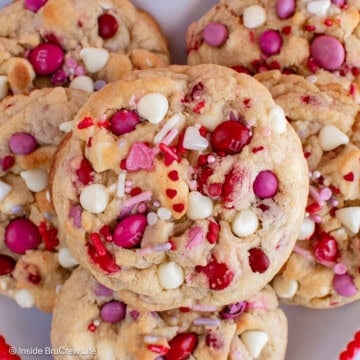 Valentine's cookies stacked on a plate.