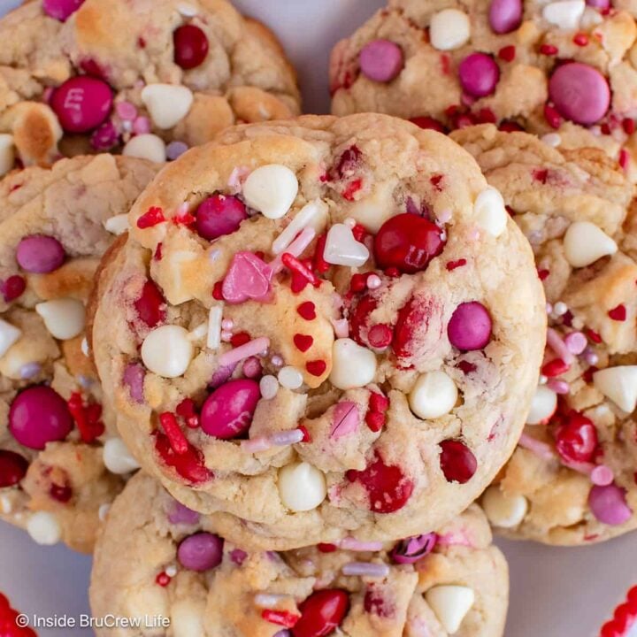 Valentine's cookies stacked on a plate.