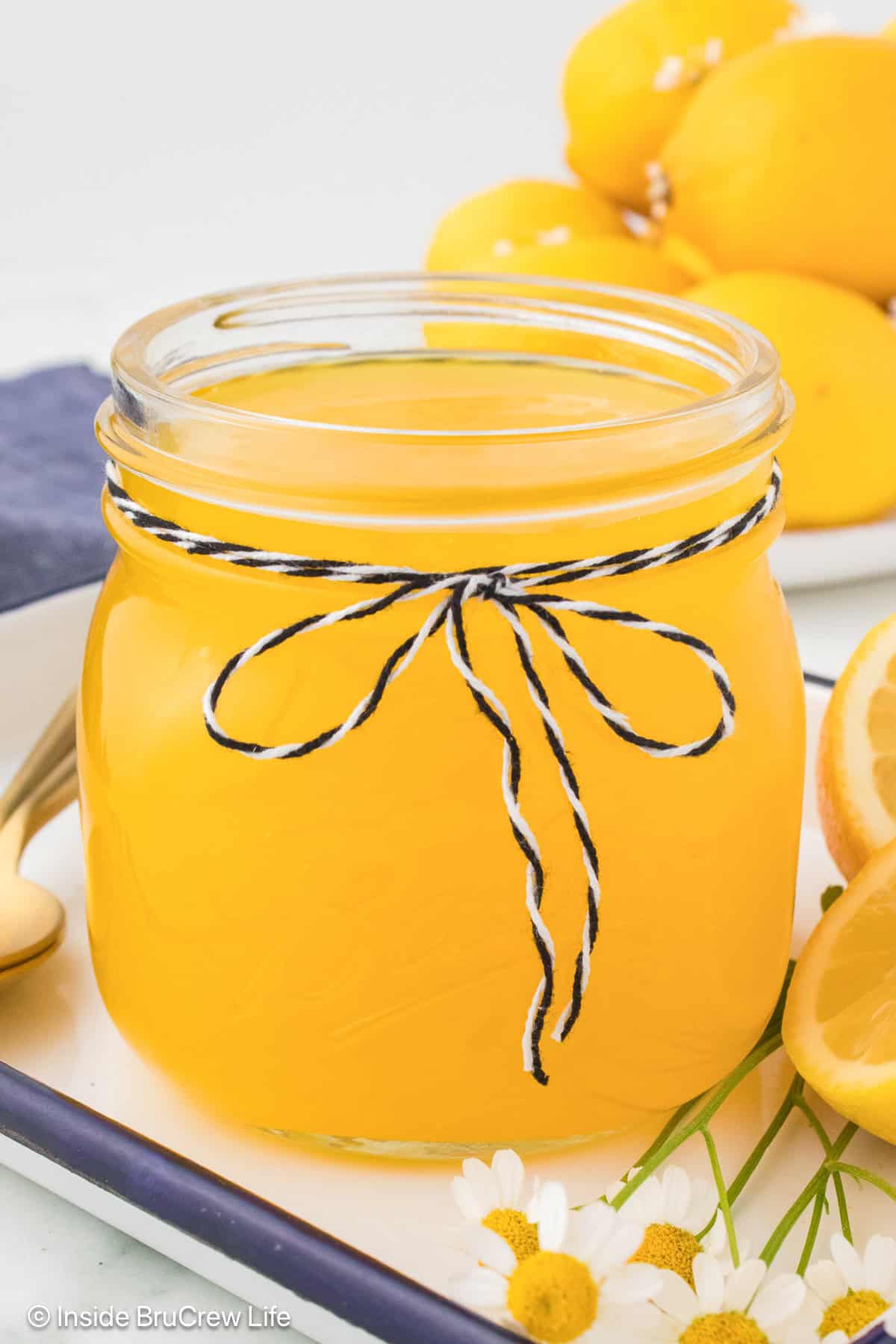 A glass jar filled with homemade lemon filling.