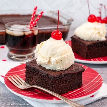 A piece of coca cola cake topped with a scoop of ice cream and a cherry.