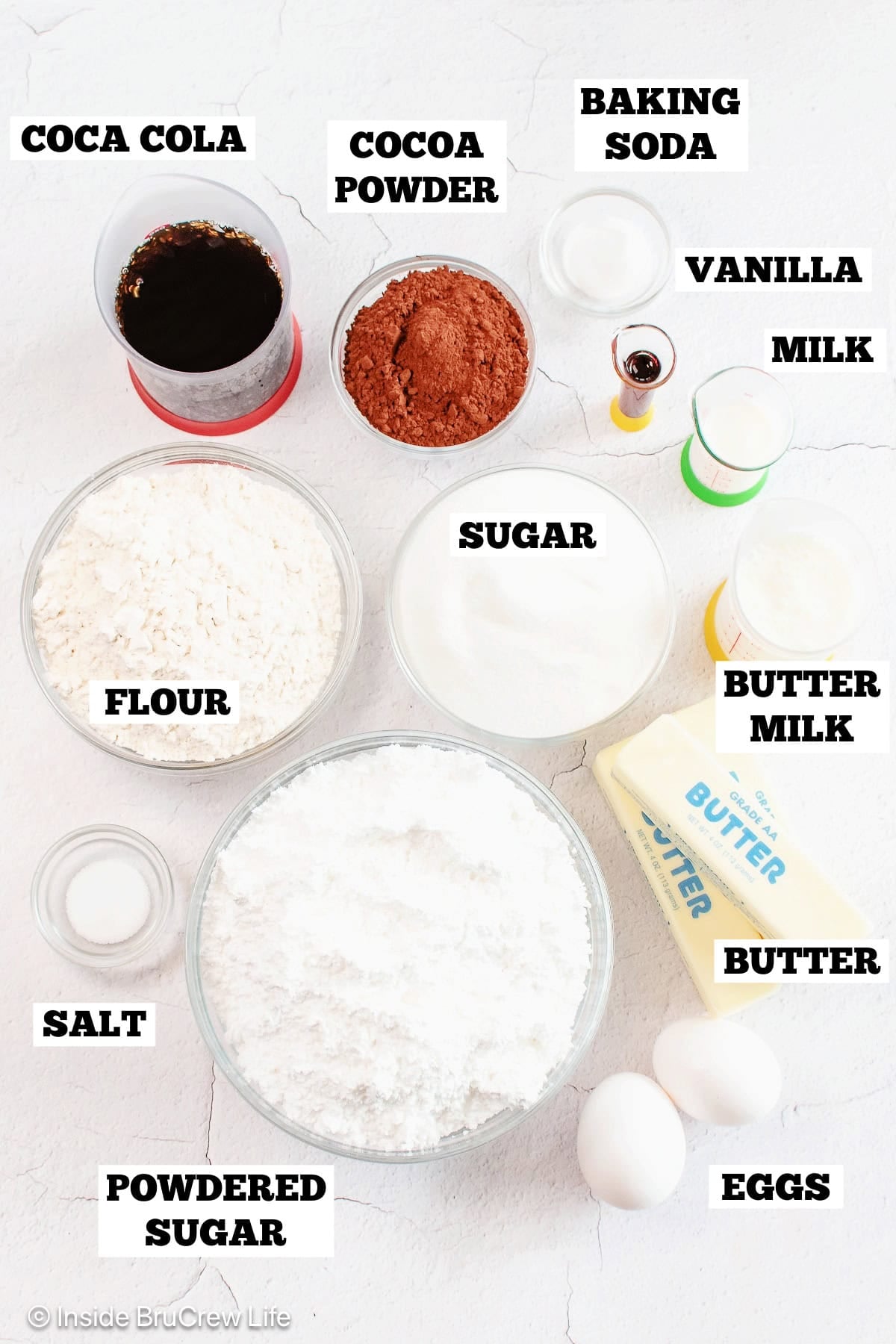 Chocolate coca cola cake ingredients with labels.