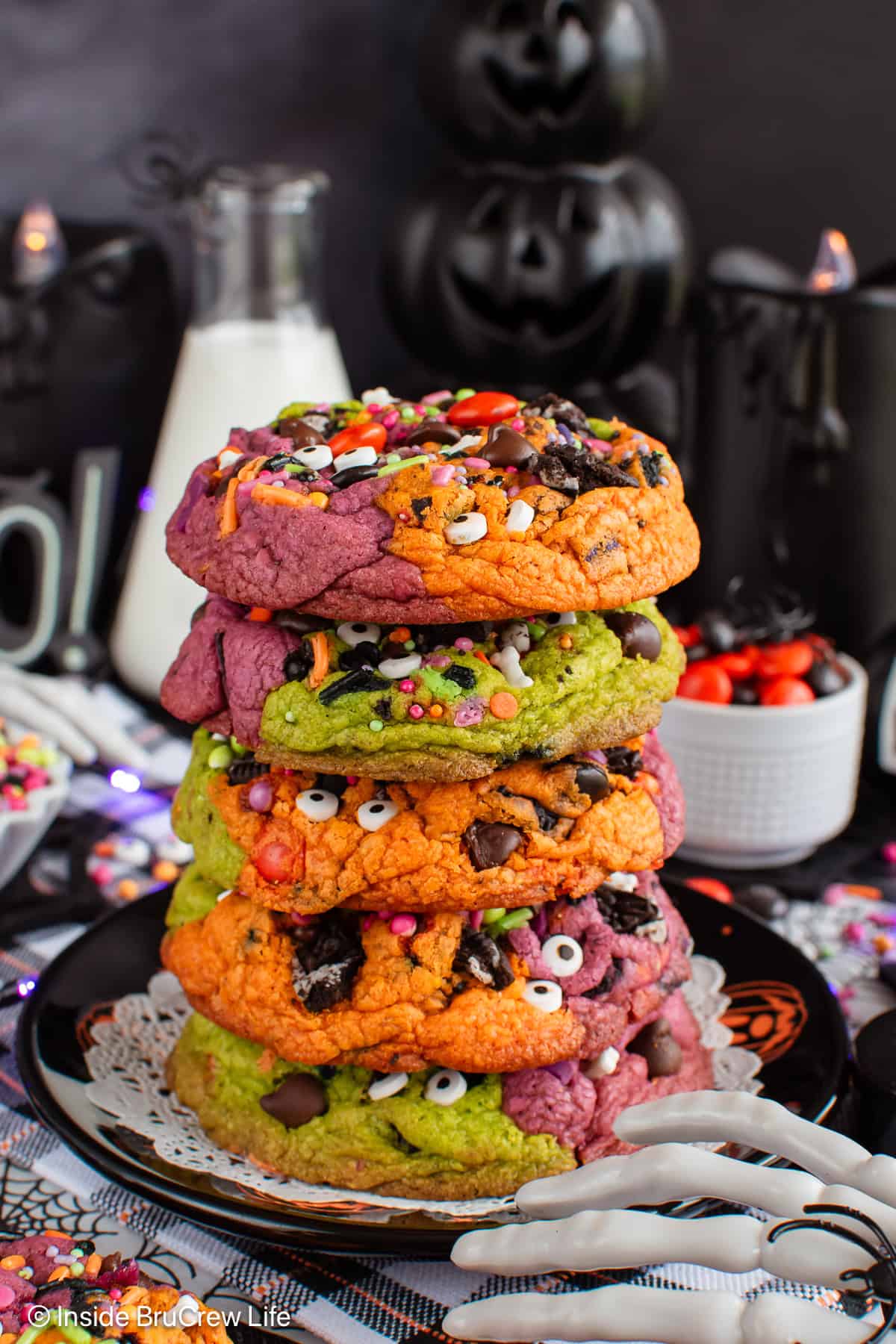 A stack of monster mash Halloween chocolate chip cookies.