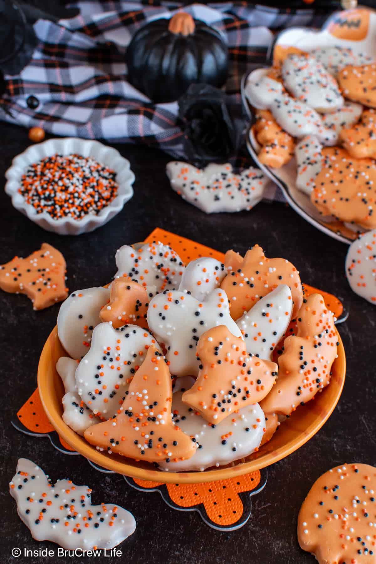 An orange bowl filled with Halloween frosted animal crackers.