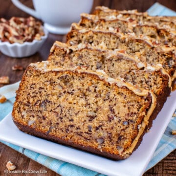 Slices of maple pecan bread on a white plate.